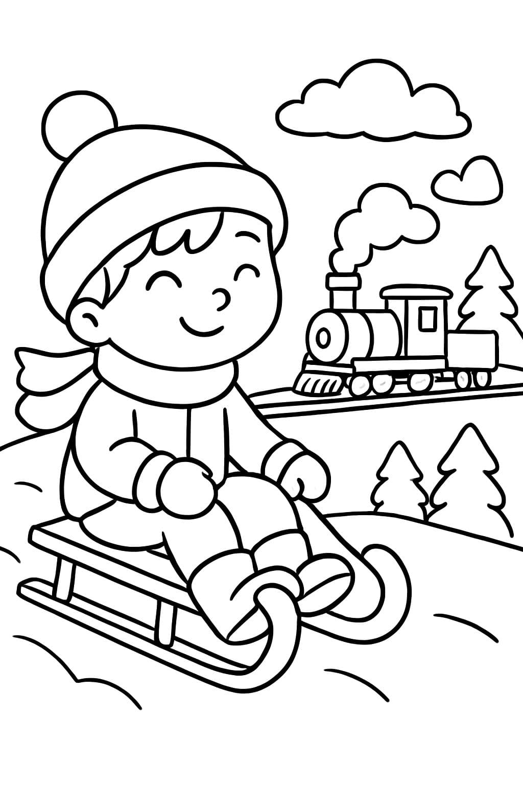 niño deslizándose en trineo con un tren al fondo
