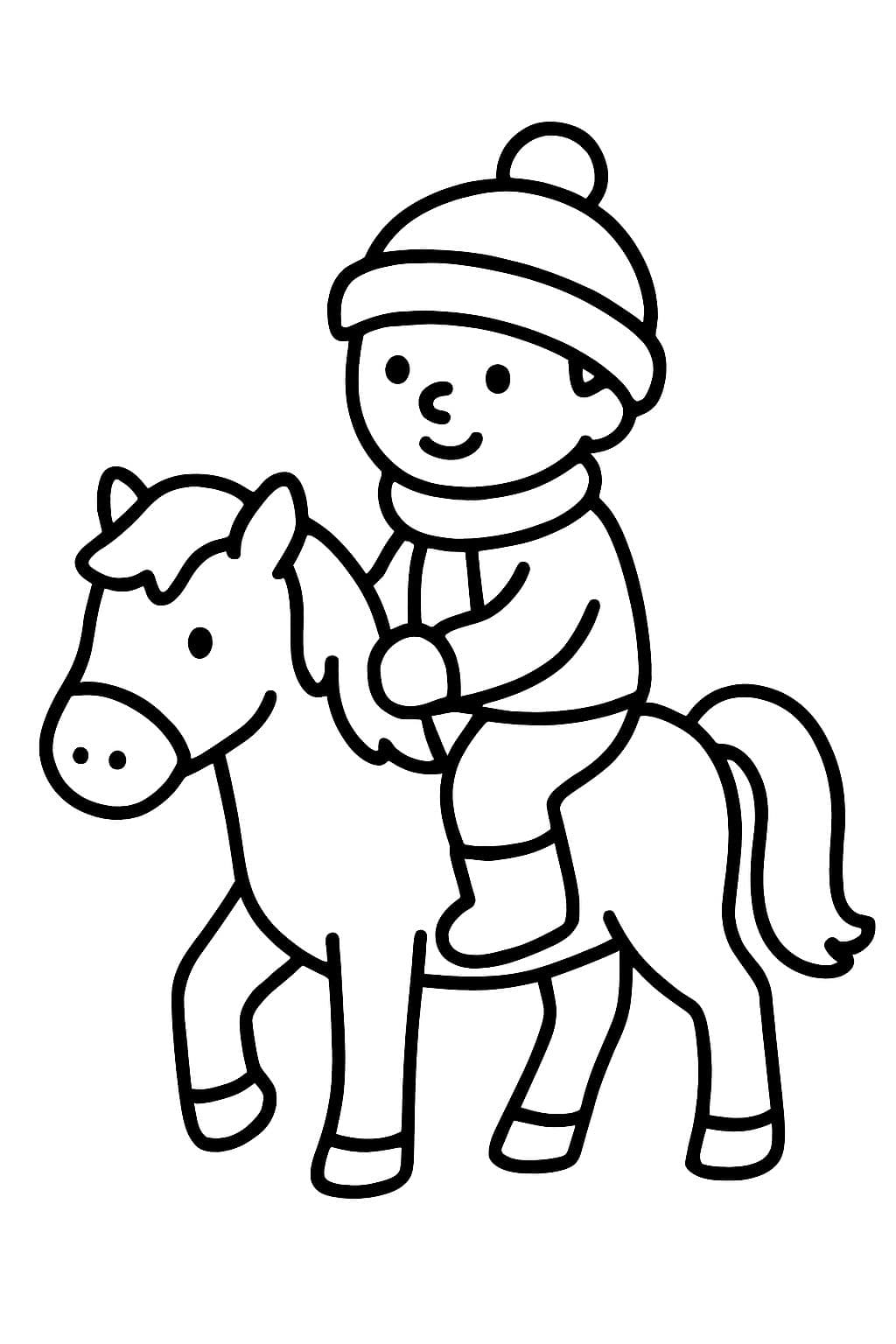 Ein kleiner Junge der auf einem Pony reitet und hat warme klamotten an